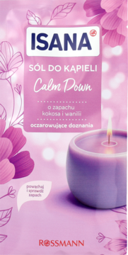 Różowe opakowanie soli do kąpieli Isana Calm Down o zapachu kokosa i wanilii, z widoczną świecą.