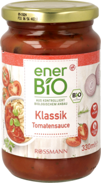 Słoik organicznego sosu pomidorowego EnerBIO Klassik, czerwona etykieta z ilustracją pomidorów i pasty, 330ml.