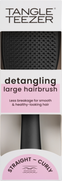 Tangle Teezer detangling large hairbrush in white and pink packaging, black bristles visible. For straight to curly hair.