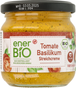 Słoik enerBIO Pasta pomidorowo-bazyliowa, żółto-pomarańczowa, z zieloną etykietą i czarną nakrętką, widok z przodu.
