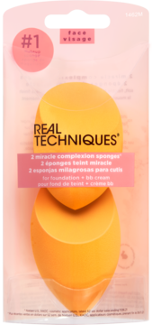 Two orange Real Techniques Miracle Complexion Sponges for foundation in clear retail pack, frontal view, label #1.