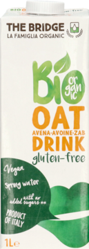 Biały karton The Bridge Bio Oat Drink 1L, gluten-free i vegan, z zielono-pomarańczowymi napisami, widok z przodu.