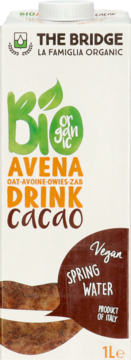 The Bridge Bio Organic Oat Drink Cacao w białym kartonie z zielono-pomarańczowymi napisami, widok z przodu.