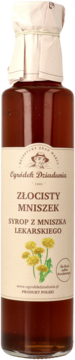 Złocisty Mniszek syrop z mniszka lekarskiego w szklanej butelce, beżowa etykieta z kwiatami mniszka, widok z przodu.