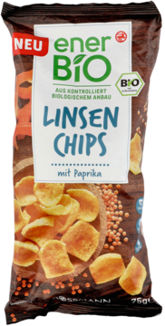 Czarna paczka enerBiO Linsen Chips paprykowe z napisem NEU, widok z przodu, złociste chipsy i soczewica.