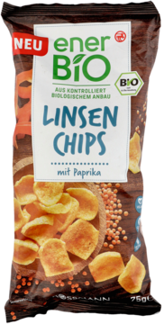 Czarna paczka enerBiO Linsen Chips paprykowe z napisem NEU, widok z przodu, złociste chipsy i soczewica.