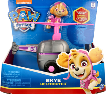 Zabawka Psi Patrol: helikopter Skye w pudełku. Szaro-różowy pojazd z figurką Skye, widok frontowy opakowania.