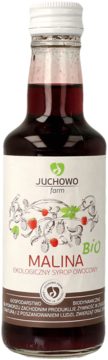 Butelka ekologicznego syropu owocowego Malina Juchowo Farm, czerwony płyn, biała etykieta z BIO i malinami.
