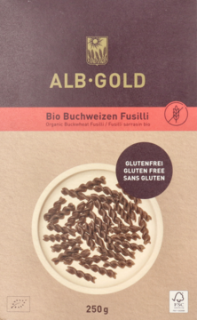 Opakowanie ekologicznego makaronu gryczanego Alb-Gold Fusilli na papierze kraft, bezglutenowy, z widocznymi ciemnymi świderkami.