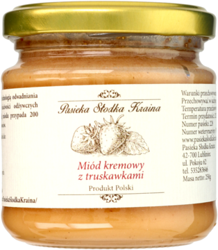 Słoik kremowego miodu truskawkowego z białą etykietą i rysunkami truskawek, złota nakrętka, widok z przodu.