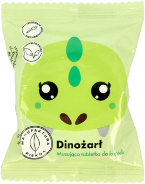 Zielona saszetka Dinożart, owocowa musująca tabletka do kąpieli z grafiką uśmiechniętego dinozaura, widok z przodu.