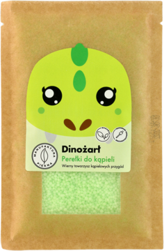 Dinożart Perełki do kąpieli w brązowej torebce z zielonym dinozaurem, przezroczyste okienko ukazuje zielone perełki, widok z przodu.