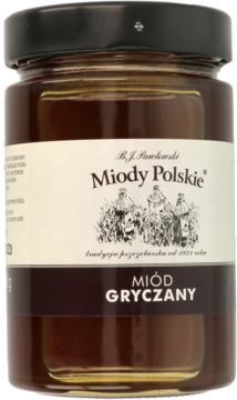 Słoik polskiego miodu gryczanego Miod Polski, ciemnobrązowy płyn, na beżowej etykiecie rysunek uli, widok z przodu.