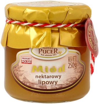 Słoik polskiego miodu nektarowego lipowego Pucer, 250g, złote wieczko z czerwoną wstążką, beżowa etykieta.