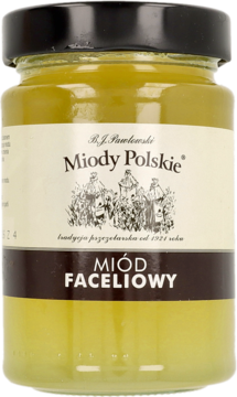 Słoik bladożółtego miodu faceliowego B.J. Pawłowski Miody Polskie, z czarną nakrętką, etykietą z ulami, widok z przodu.