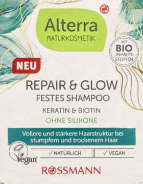 Alterra Repair & Glow solid shampoo packaging: white-green design with keratin & biotin, vegan, silicon-free. Frontal view.