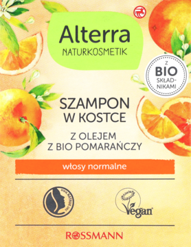 Alterra szampon w kostce do włosów normalnych, z bio pomarańczą, opakowanie przód na tle owoców.