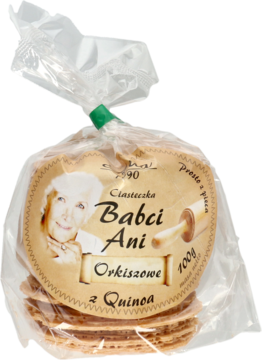 Ciasteczka Babci Ani orkiszowe z quinoa w przezroczystym opakowaniu, z etykietą przedstawiającą babcię. Ujęcie z przodu.