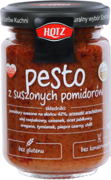 Pesto Hotz z suszonych pomidorów w szklanym słoiku, czerwono-brązowe, z czarną etykietą 'bez glutenu', widok z przodu.