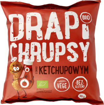 Czerwone opakowanie chrupek DRAPI CHRUPSY BIO ketchupowych, z wesołą postacią i etykietami VEGE, BEZ GLUTENU.