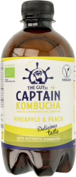 Brązowa butelka Captain Kombucha Pineapple & Peach, bio-organiczna, wegańska, z żółto-białą etykietą. Widok z przodu.