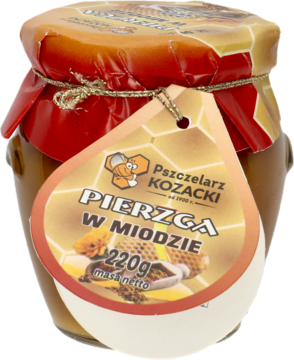 Szklany słoik Pierzgi w Miodzie Pszczelarz Kozacki, 220g, z beżową etykietą i złotym opakowaniem wieczka, widok z przodu.