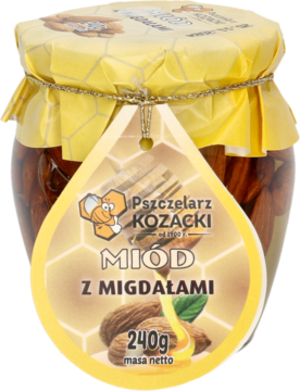 Frontalny widok szklanego słoika miodu Pszczelarz Kozacki z migdałami 240g, z żółtą ozdobną pokrywą i etykietą.