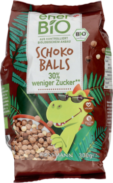 Przód brązowej torebki enerBiO Schoko Balls, 30% mniej cukru, z dinozaurem w okularach.