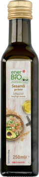 EnerBiO prażony olej sezamowy w ciemnej szklanej butelce z złotą zakrętką, z przodu etykieta z miską jedzenia, 250ml.