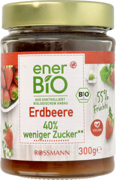 EnerBio Dżem truskawkowy w szklanym słoiku z widoczną etykietą "40% mniej cukru", "BIO" i "VEGAN".