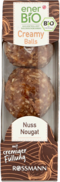 enerBiO Creamy Balls Nuss Nougat: dwie brązowe bio-kulki z orzechowym nadzieniem, w opakowaniu, widok z przodu.