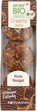 enerBiO Creamy Balls Nuss Nougat: dwie brązowe bio-kulki z orzechowym nadzieniem, w opakowaniu, widok z przodu.