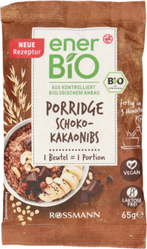 Brązowe opakowanie enerBio Porridge Schoko-Kakaonibs 65g, wegańska, bez laktozy, z miską owsianki i kakao.