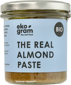 Słoik Eko Gram BIO The Real Almond Paste, pasta z prażonych migdałów, jasnoniebieska etykieta.