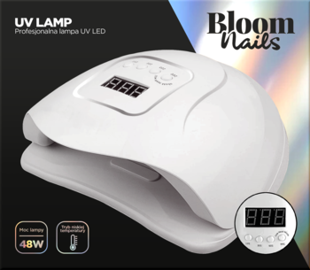 Biała, owalna lampa UV LED 48W do paznokci Bloom Nails, z cyfrowym wyświetlaczem, na ciemnym tle.