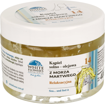 Biały słoik White Flowers z żółtą kąpielą solno-olejową z Morza Martwego, relaksacyjna, widok z góry.