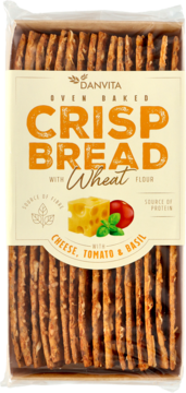 Przezroczyste opakowanie Danvita Oven Baked Crisp Bread z serem, pomidorem i bazylią, widoczne ułożone chlebki.