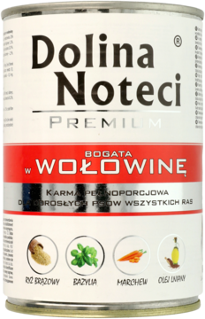 Srebrna puszka karmy Dolina Noteci Premium "Wołowina" dla psów, z czerwoną etykietą i grafikami składników, widok z przodu.