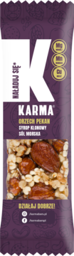 Baton Karma Orzech Pekan, syrop klonowy, sól morska w fioletowym opakowaniu. Widoczne orzechy, Mg, Mn, Cu.