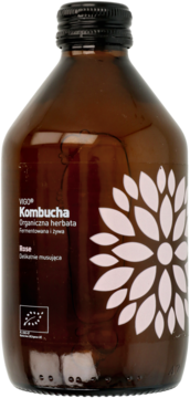 VIGO Kombucha Rose, organiczna herbata w brązowej butelce z kwiatowym wzorem na etykiecie, widok z przodu.