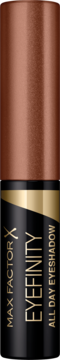 Metaliczny cień-eyeliner Max Factor Eyefinity, miedziano-czarna tubka z złotym napisem, widok z przodu.