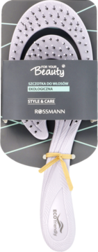 Ekologiczna szczotka do włosów Rossmann Style & Care, biała, z elastycznymi igłami, w ciemnym opakowaniu. Widok z przodu.
