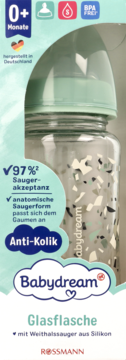 Szklana butelka Babydream Anti-Kolik 0+ z anatomicznym smoczkiem, częściowo widoczna w zielonym opakowaniu.