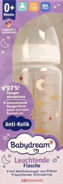 Babydream Leuchtende Flasche antykolikowa, biała, silikonowy smoczek, w fioletowym opakowaniu z księżycem i gwiazdkami.