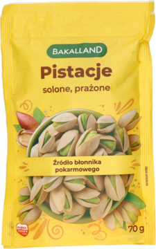 Pistacje solone i prażone Bakalland w żółtym opakowaniu 70g, z ilustracją orzechów, widok z przodu.