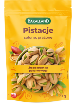 Bakalland Pistacje solone prażone 70g, żółta paczka z orzechami i mango, źródło błonnika, widok z przodu.