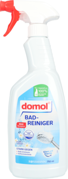 Domol Płyn do czyszczenia łazienek 750ml, biała butelka ze spryskiwaczem, etykieta z niebieskimi detalami, widok z przodu.