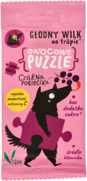 Front różowej saszetki Głodny Wilk Owocowe Puzzle Czarna Porzeczka, z czarnym wilkiem i puzzlem, bogate w wit. C.