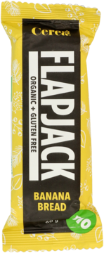 Ekologiczny baton Flapjack Banana Bread Cerea, organiczny i bezglutenowy, w żółto-czarnym opakowaniu, widok z przodu.