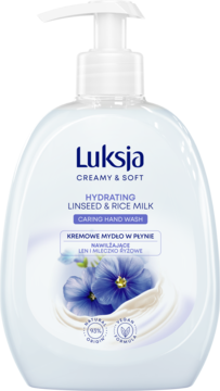 Białe mydło w płynie Luksja Creamy & Soft, nawilżające z lnem i ryżem, w butelce z pompką, widok z przodu.